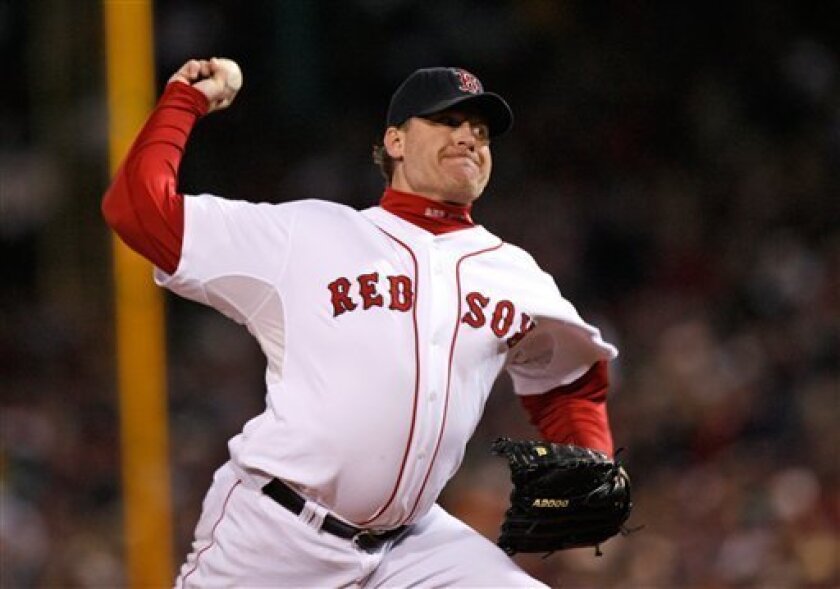 In this Oct. 25, 2007 file photo, Boston Red Sox's Curt Schilling pitches against the Colorado Rockies in Game 2 of the baseball World Series at Fenway Park in Boston. Schilling says he's out for the season, and his career may be over. The 41-year-old Boston Red Sox right-hander said Friday June 20, 2008 on radio station WEEI he will have shoulder surgery next week. (AP Photo/Kathy Willens)