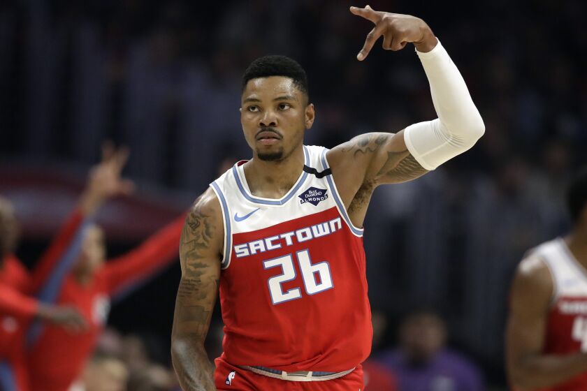 Sacramento Kings' Kent Bazemore (26) reacts after scoring against the Los Angeles Clippers during the first half of an NBA basketball game Saturday, Feb. 22, 2020, in Los Angeles. (AP Photo/Marcio Jose Sanchez)