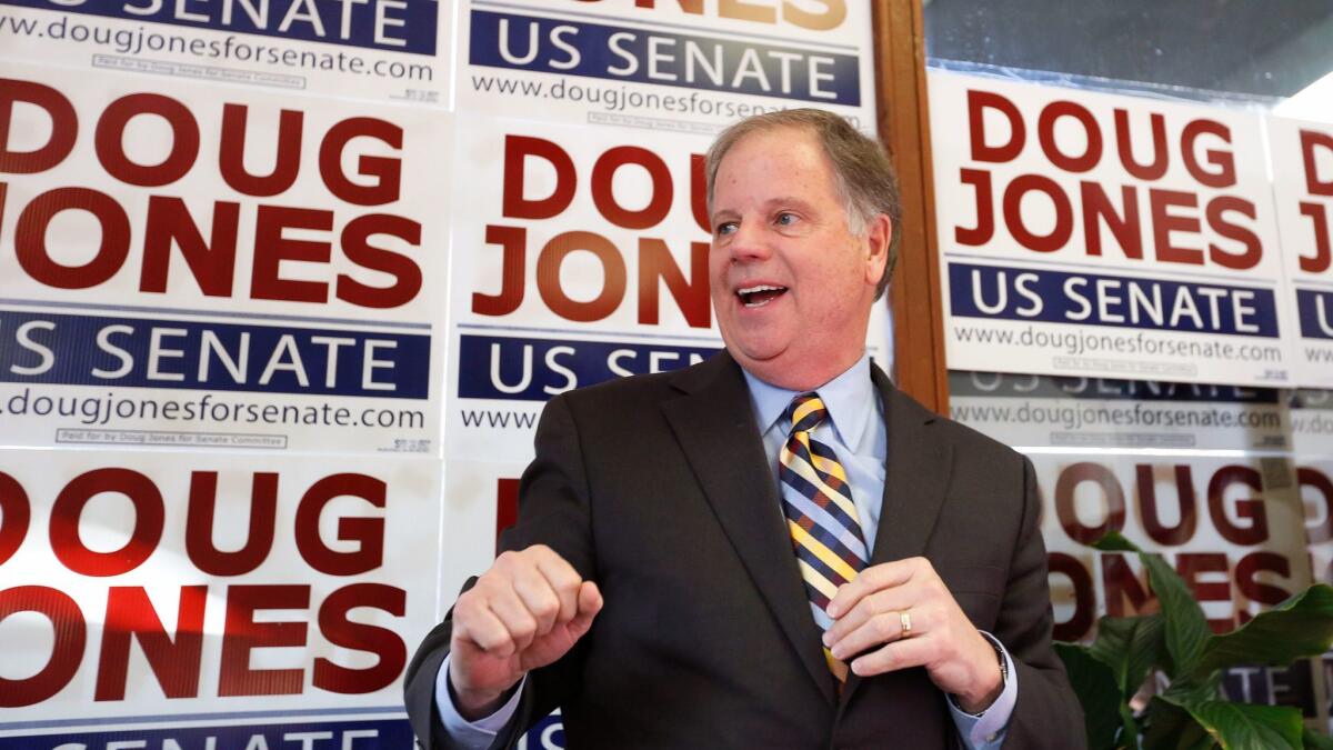 Democratic Senate candidate Doug Jones campaigns in Birmingham, Ala.