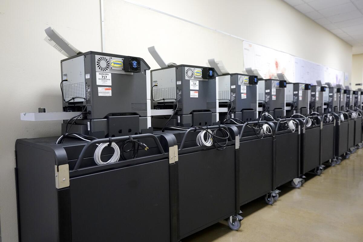 Affidavit printers are lined up at the Maricopa County Elections Department in Phoenix in September.