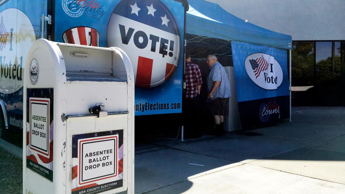 Idaho voters visit a food-truck-inspired pop-up voting location in Boise on Sept. 27. Tens of thousands of ballots have already been cast nationwide, with weeks to go until the general election.