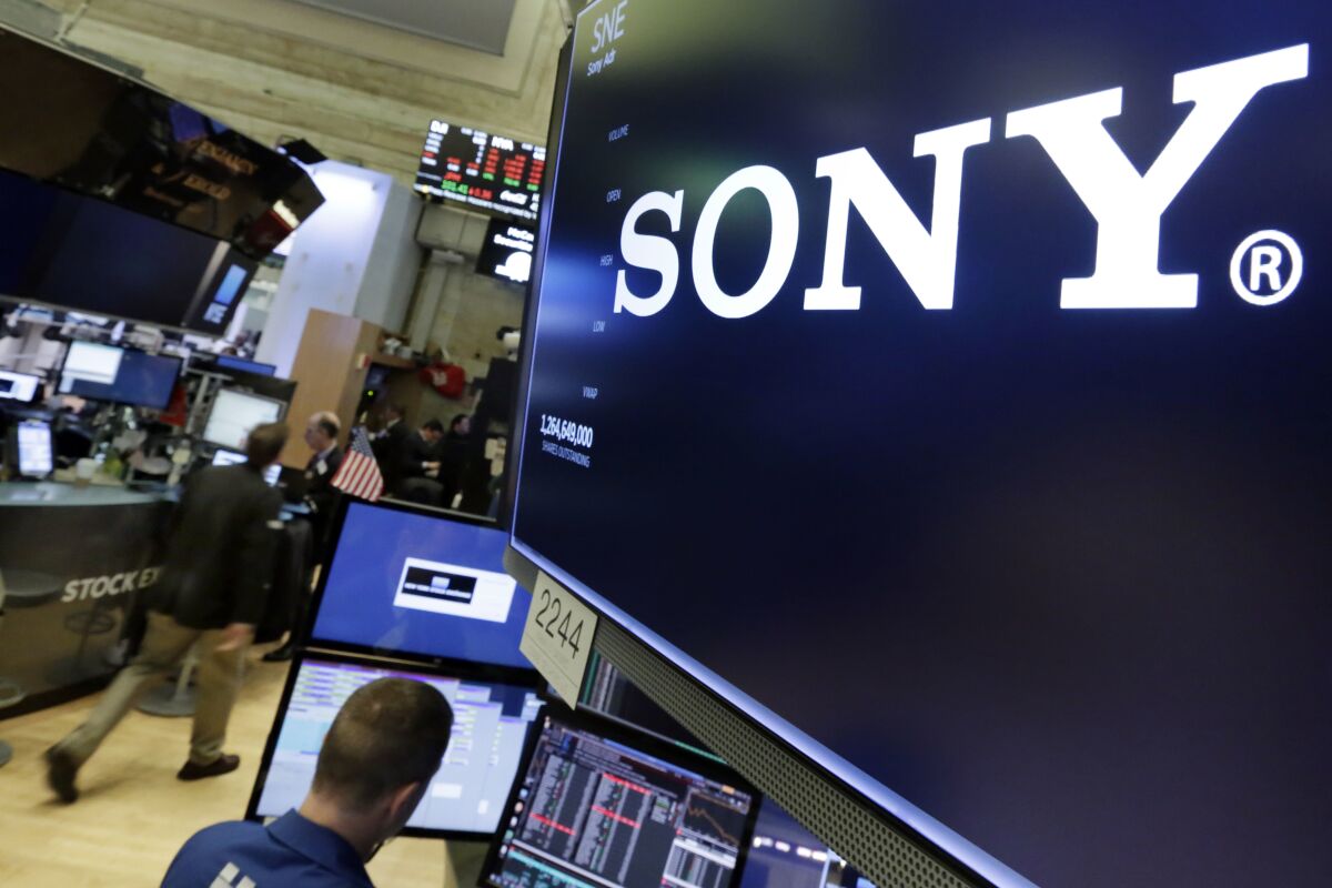 FILE - The Sony logo appears on a screen above the trading floor of the New York Stock Exchange, Tuesday, Oct. 31, 2017. Sony’s profit for the quarter through December edged up 11% on healthy sales from its film division, including the new Spider-Man movie, the Japanese electronics and entertainment company said Wednesday, Feb. 2, 2022. (AP Photo/Richard Drew, File)