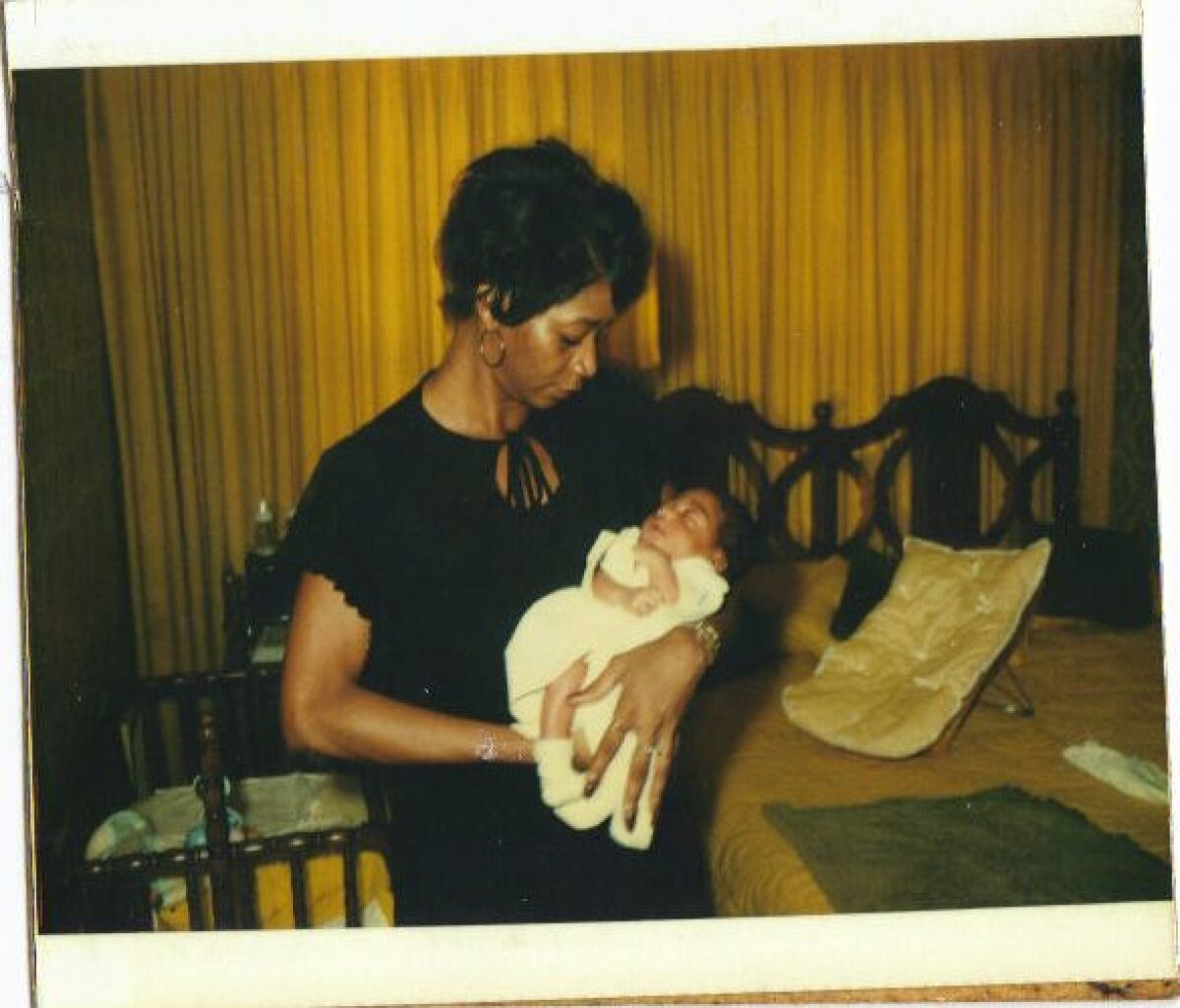 In this vintage photo, Lynda C. Hubbard holds her infant son, Yuri Williams.