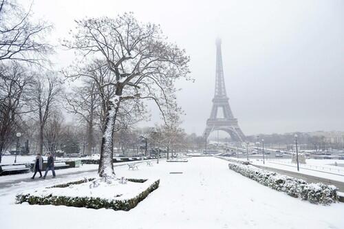 The Eiffel Tower looms over a rarely all-white Trocadero Gardens on Monday.