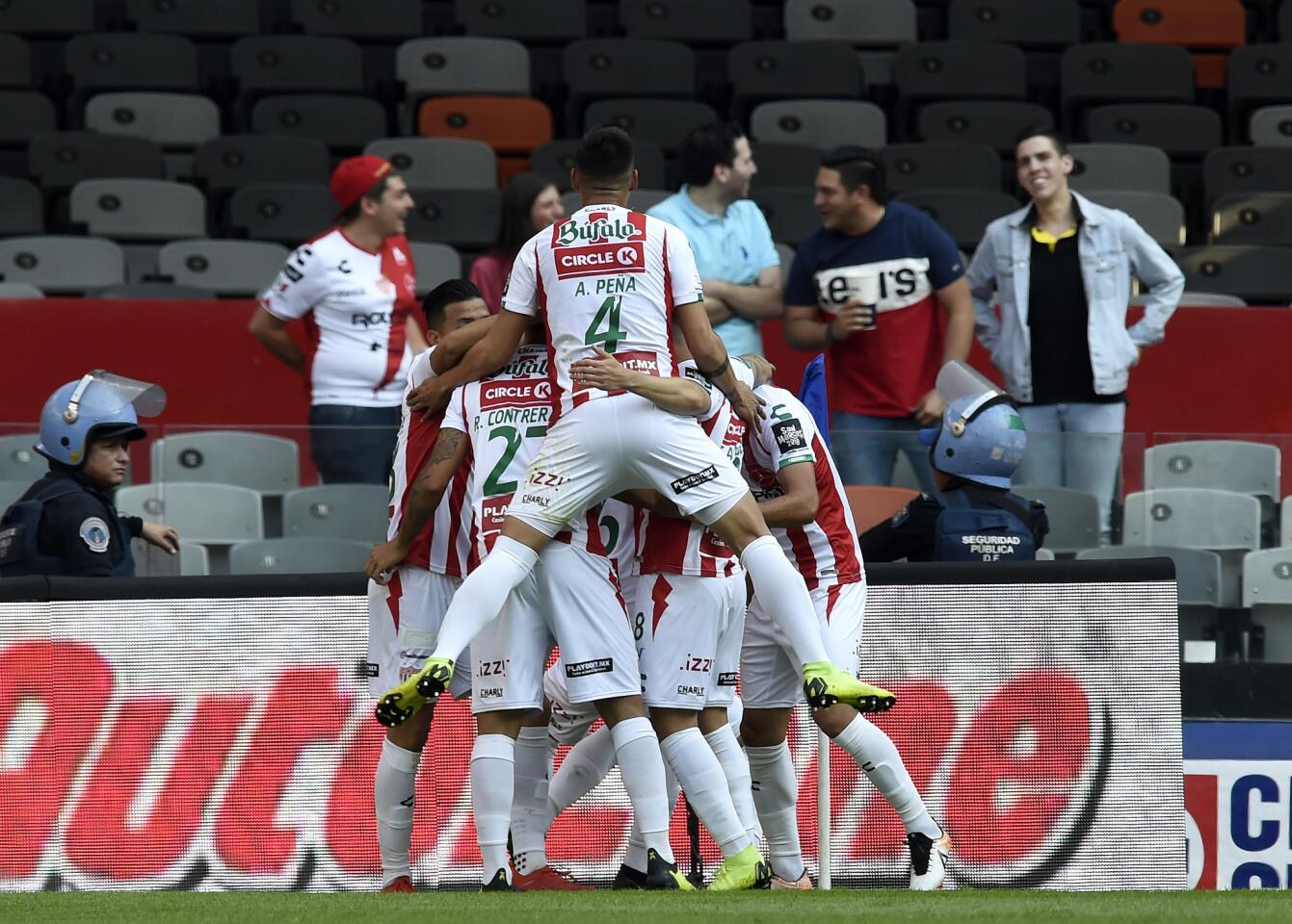 Necaxa players celebrate a goal against Cruz Azul during a Mexican Apertura tournament football match at the Azteca stadium in Mexico City on March 2, 2019. (Photo by ALFREDO ESTRELLA / AFP)ALFREDO ESTRELLA/AFP/Getty Images ** OUTS - ELSENT, FPG, CM - OUTS * NM, PH, VA if sourced by CT, LA or MoD **