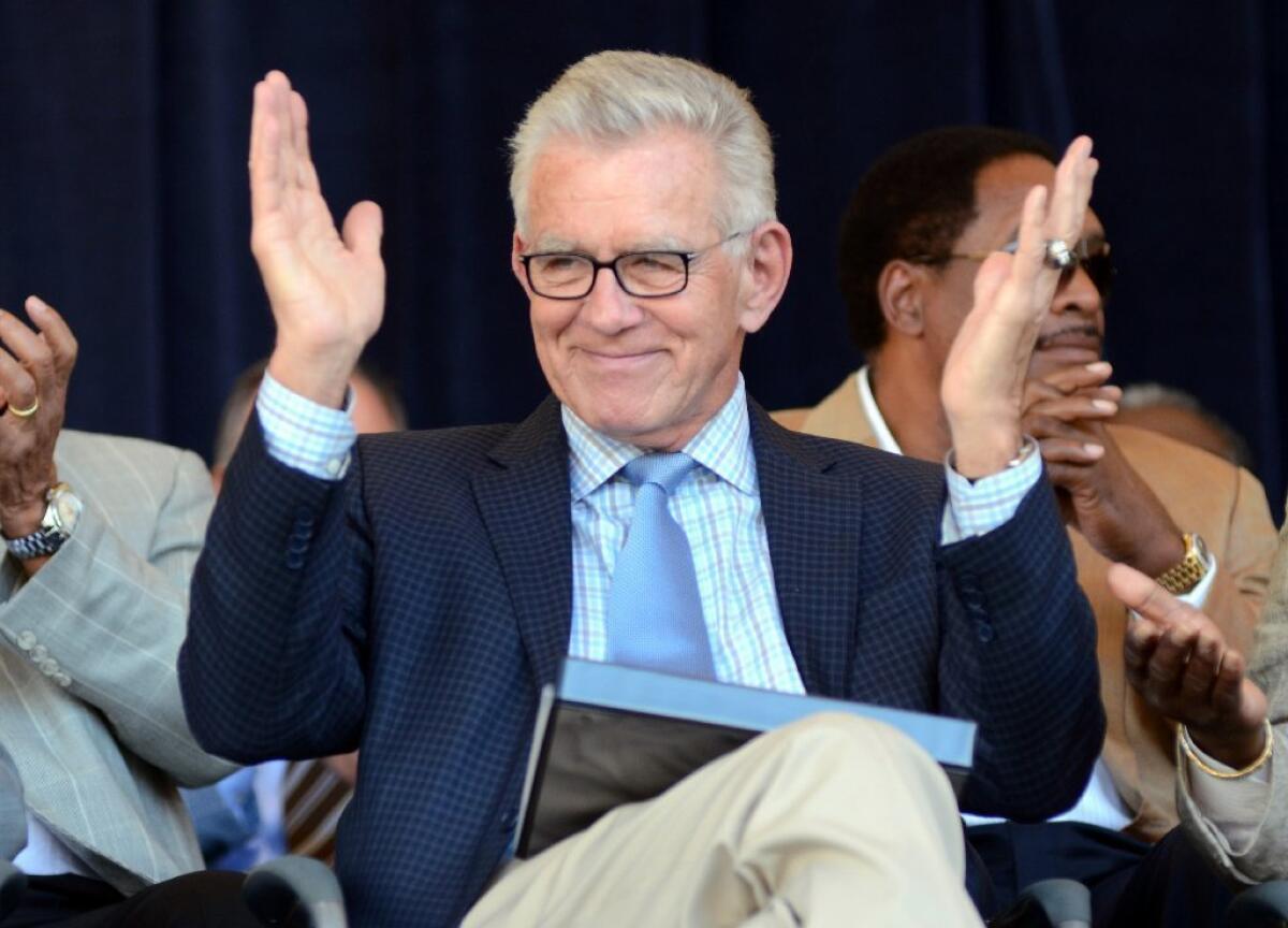 Tim McCarver greets the crowd before accepting the Ford C. Frick Award at the Baseball Hall of Fame last year.