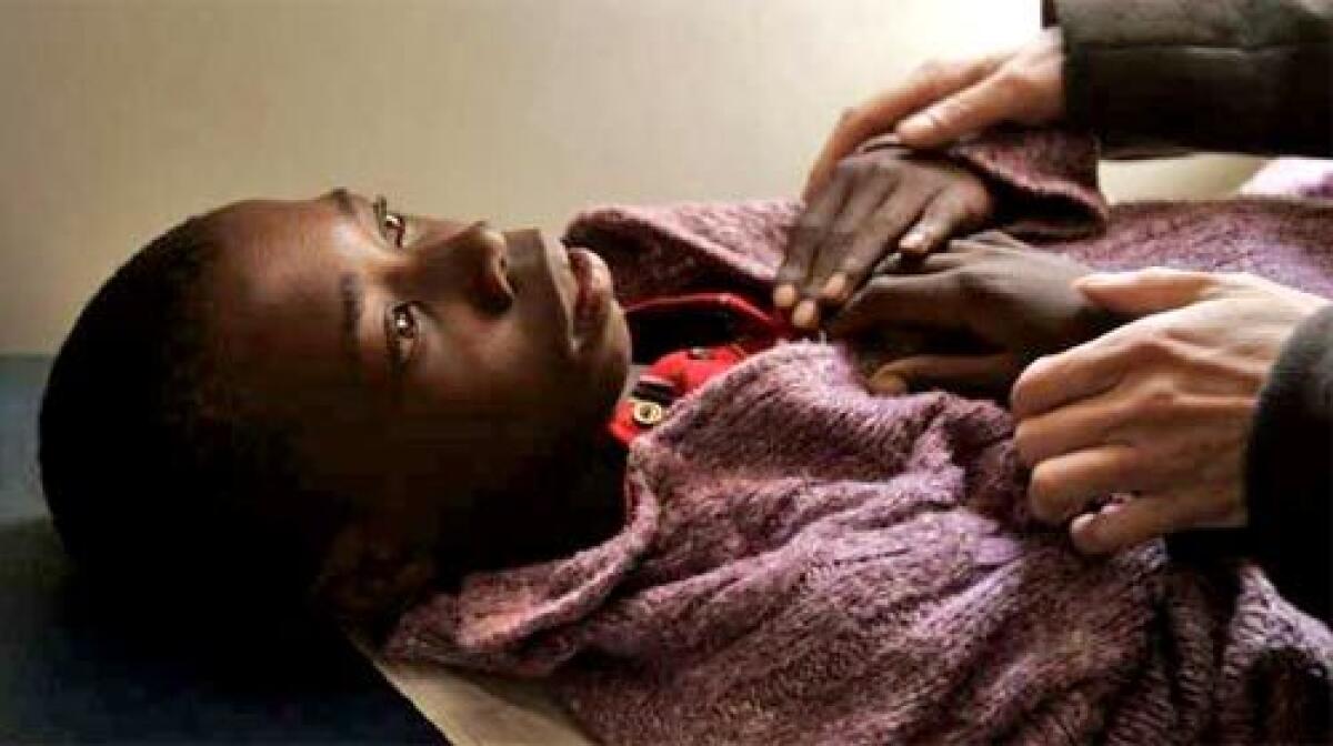 REFUGE FOR THE SICK: Teboho Mahate is treated at a government clinic operated by Partners in Health in the remote mountain village of Ha Nohana, Lesotho. The boy was diagnosed with life-threatening meningitis, but recovered after treatment.