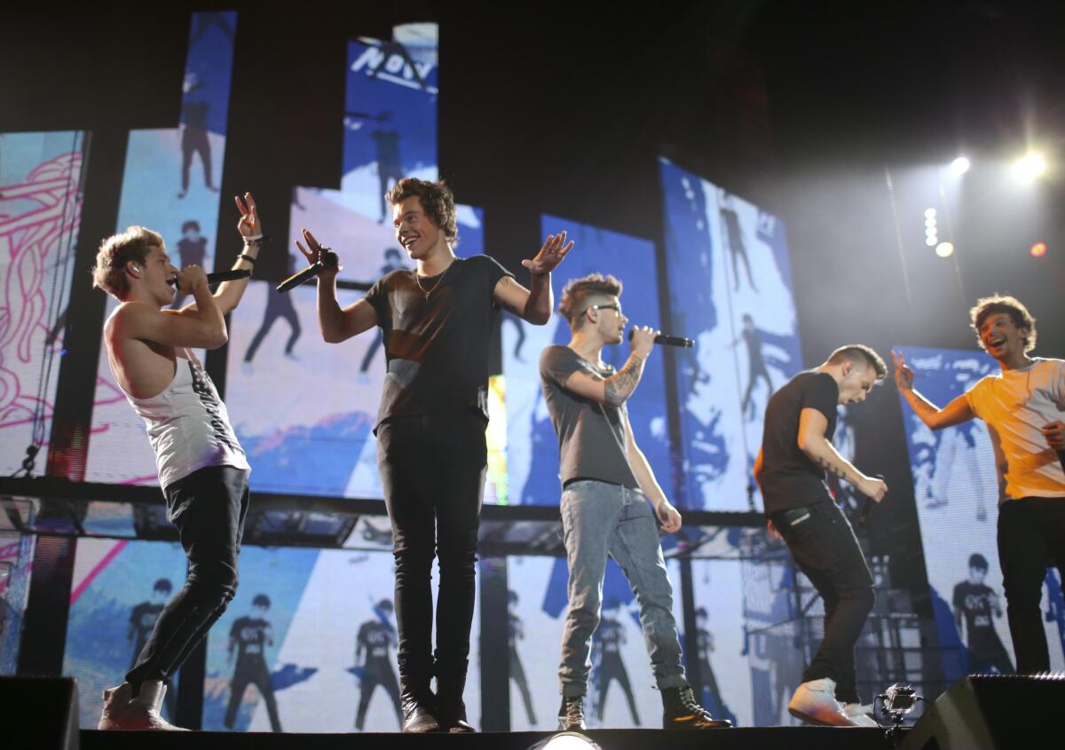 The British boy band One Direction, pictured performing Thursday night at the Target Center in Minneapolis, released a new single Friday, "Best Song Ever."