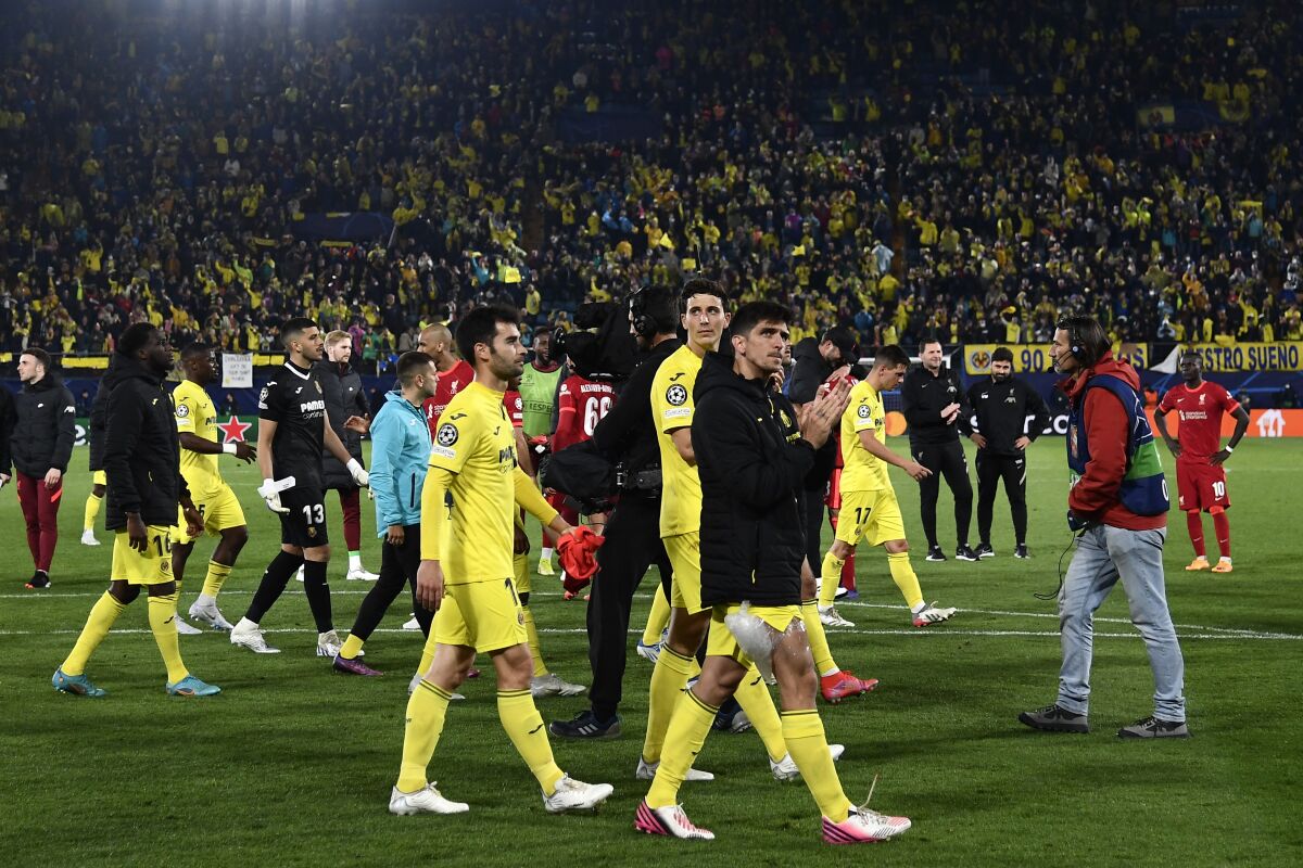 Villarreal's players walk off the pitch after the Champions League semi final, second leg soccer match between Villarreal and Liverpool at the Ceramica stadium in Villarreal, Spain, Tuesday, May 3, 2022. (AP Photo/Jose Breton)