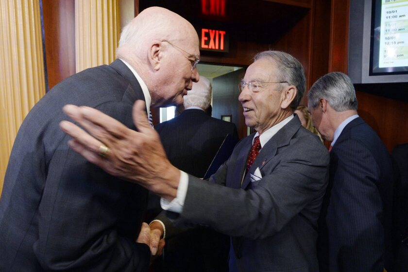 Sen. Charles E. Grassley (R-Iowa), right, chairman of the Senate Judiciary Committee, which acts on nominees to the federal bench, greets Sen. Patrick Leahy (D-Vt.), the ranking Democrat on the committee, after a Capitol Hill news conference on Oct. 1, 2015.