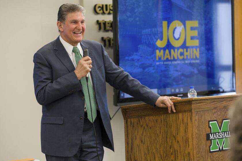 U.S. Sen. Joe Manchin, D-W.Va., speaks during a Town Hall event on Wednesday, Feb. 19, 2020, at the Robert C. Bryd Institute in Huntington, W.Va. (Sholten Singer/The Herald-Dispatch via AP)