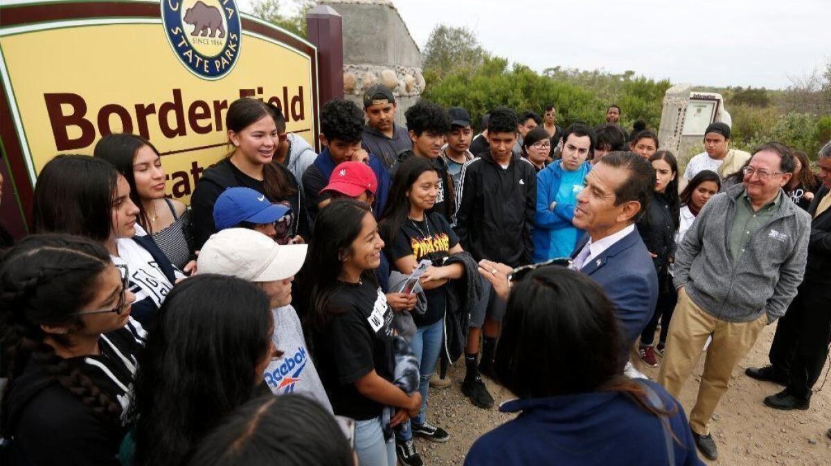 Gubernatorial Candidate Antonio Villaraigosa talks with students from KIPP Prize Preparatory Academy during a campaign stop at Border Field State Park in San Diego on May 30, 2018. The students from the San Jose school were on a field trip to see the U.S.- Mexico Border.