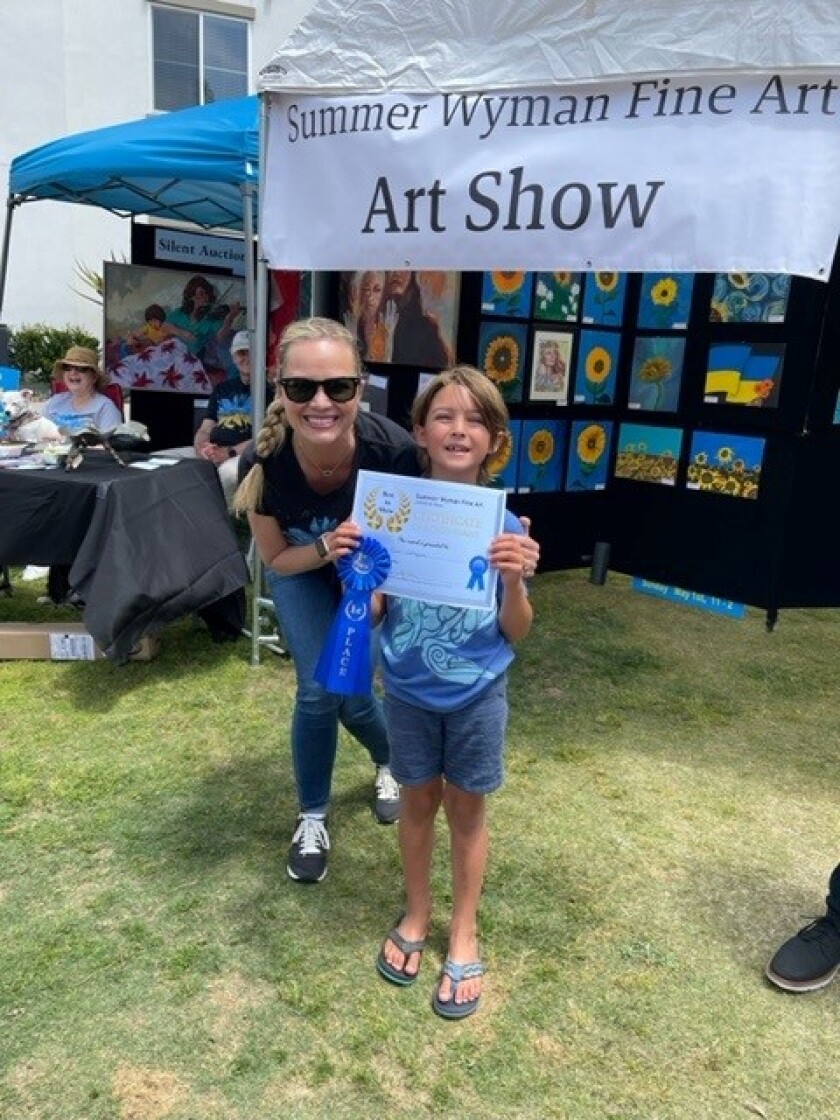 Summer Wyman and elementary school winner Nico Cabrejos.