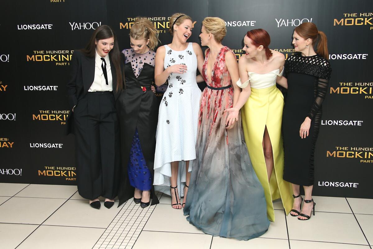 Musician Lorde, actresses Natalie Dormer, Jennifer Lawrence, Elizabeth Banks, Jena Malone and Julianne Moore get silly during the world premiere of "The Hunger Games: Mockingjay Part 1" in London on Nov. 10, 2014.