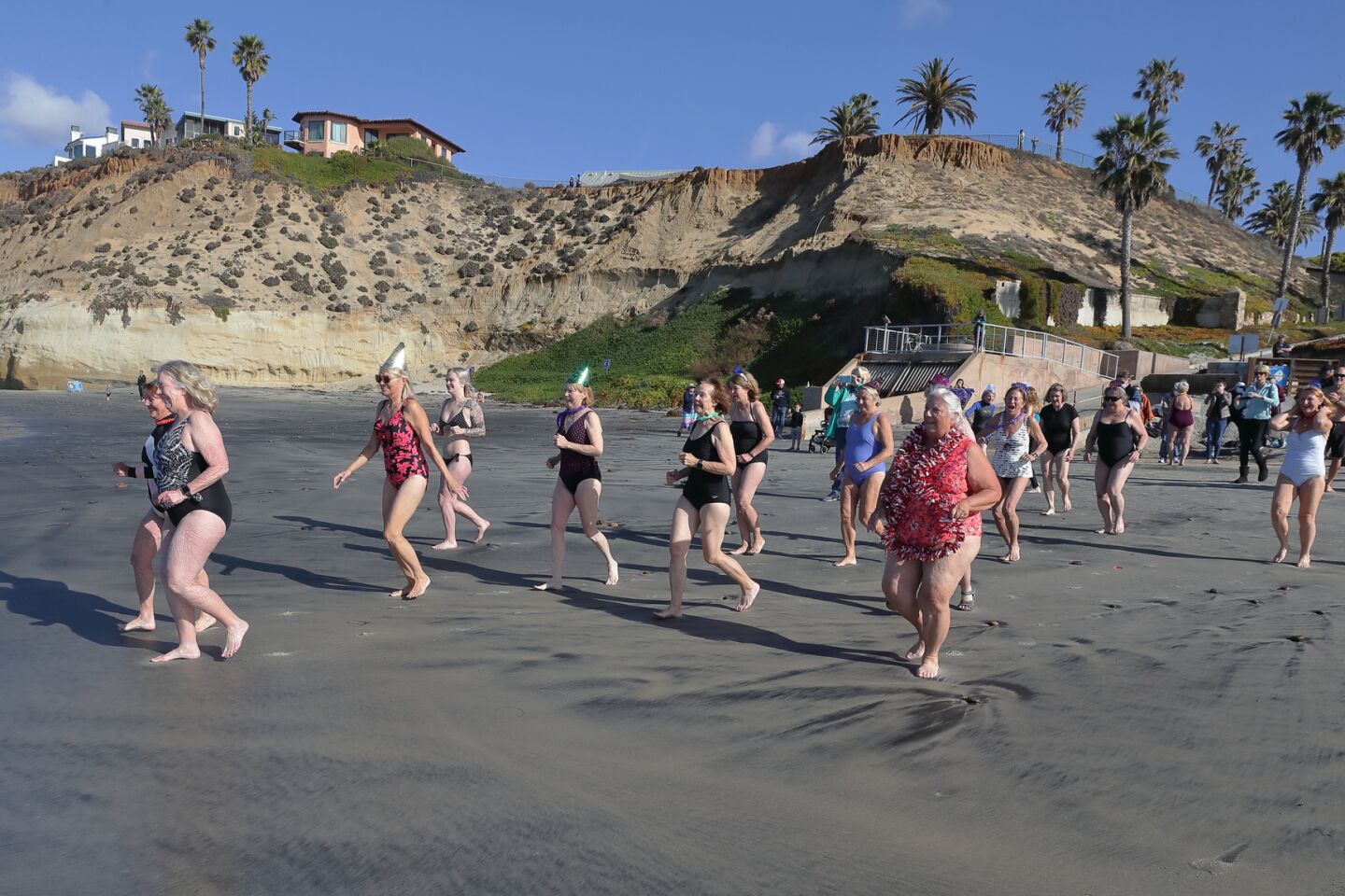 Members of the San Dieguito Boogie Babes plunged into the ocean on New Years Day 2022 at Fletcher Cove in Solana Beach