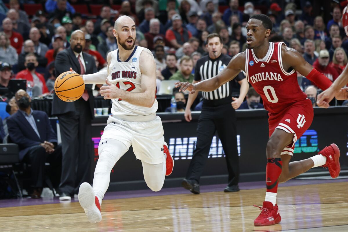 St. Mary's Tommy Kuhse drives against Indiana's Xavier Johnson in an NCAA college basketball first-round game March 17, 2022.