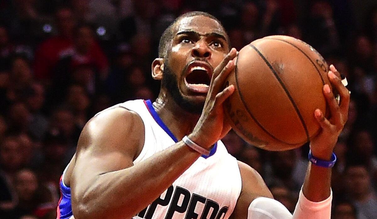 The Clippers' Chris Paul scores off an inbound steal against Oklahoma City on Monday night.
