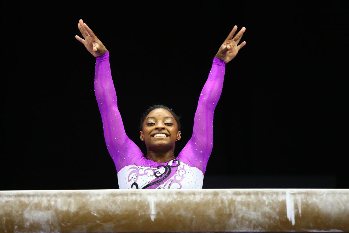Simone Biles gets ready to compete on the balance beam during the first day of the 2016 P&G Gymnastics Championships in St. Louis, Missouri.