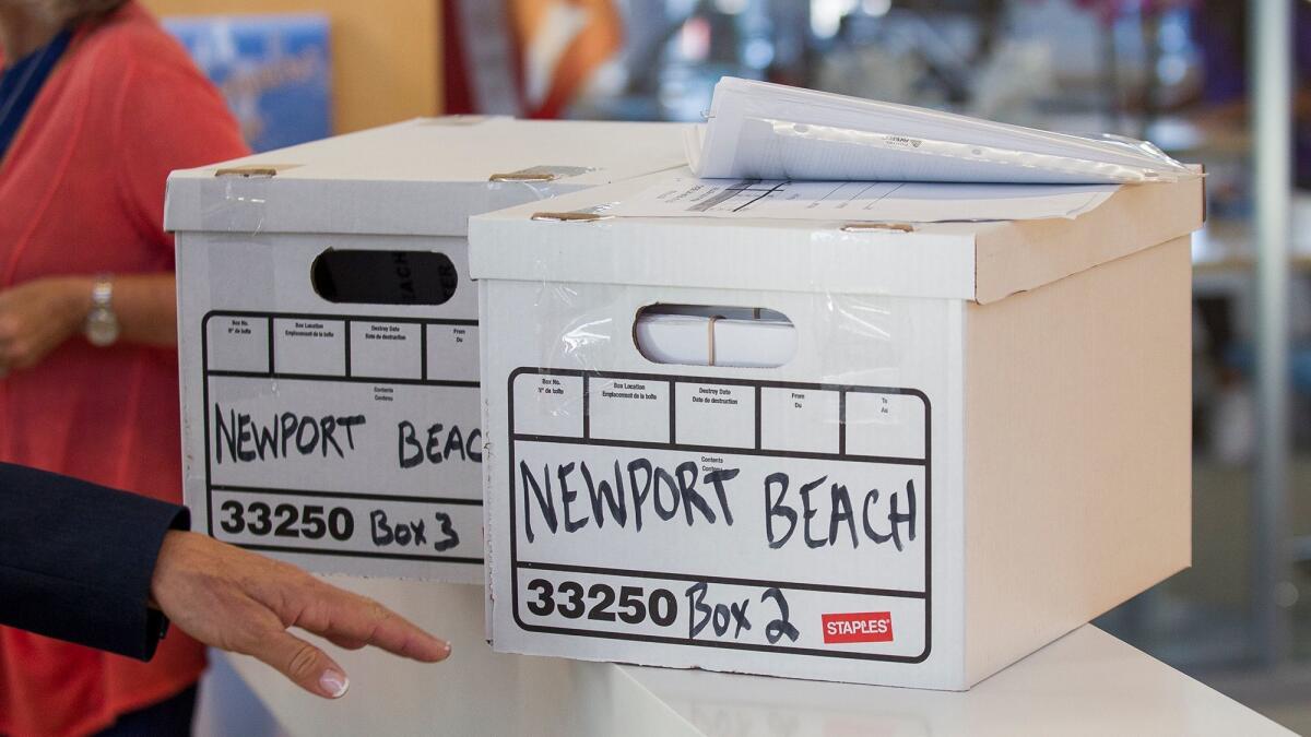 Two boxes filled with 10,684 petitions wait to be counted by the Newport Beach city clerk in October. The campaign failed to get enough signatures.