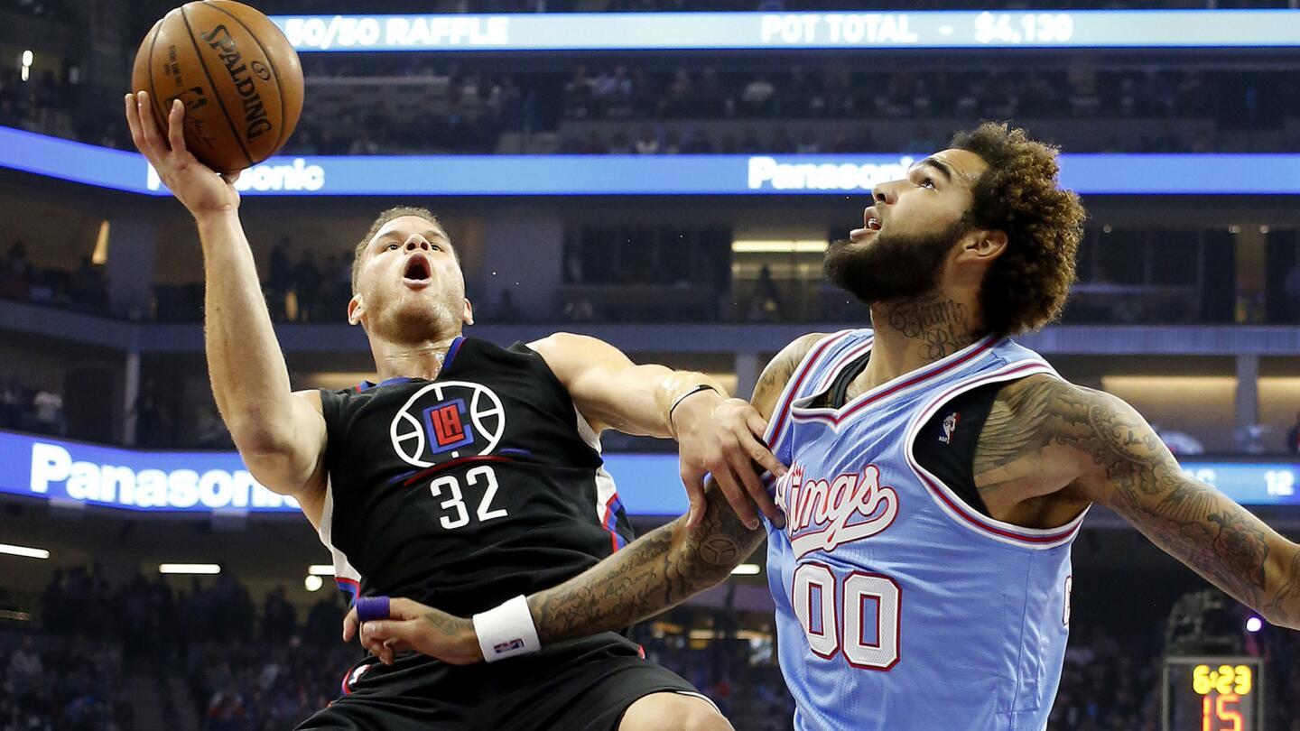 Clippers forward Blake Griffin looks to score on an offensive against Kings center Willie Cauley-Stein during the first half.