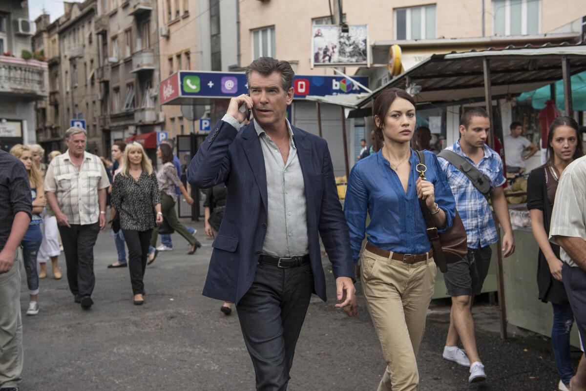 Pierce Brosnan and Olga Kurylenko in the espionage thriller "The November Man."