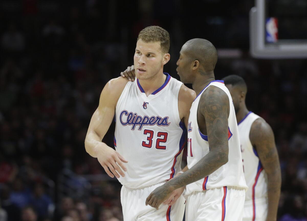 Jamal Crawford talks with Blake Griffin during the first half of a game against the Toronto Raptors on Dec. 27.