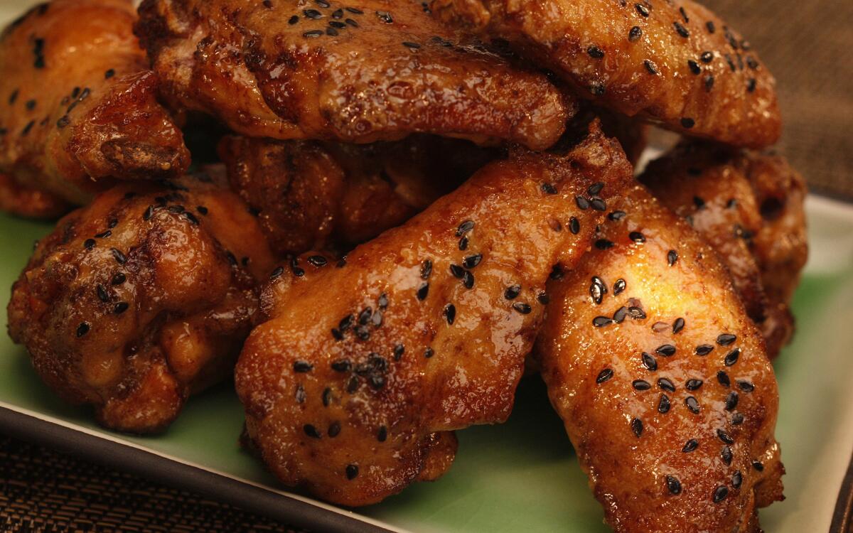 Thai peanut chicken wings speckled with nigella seeds
