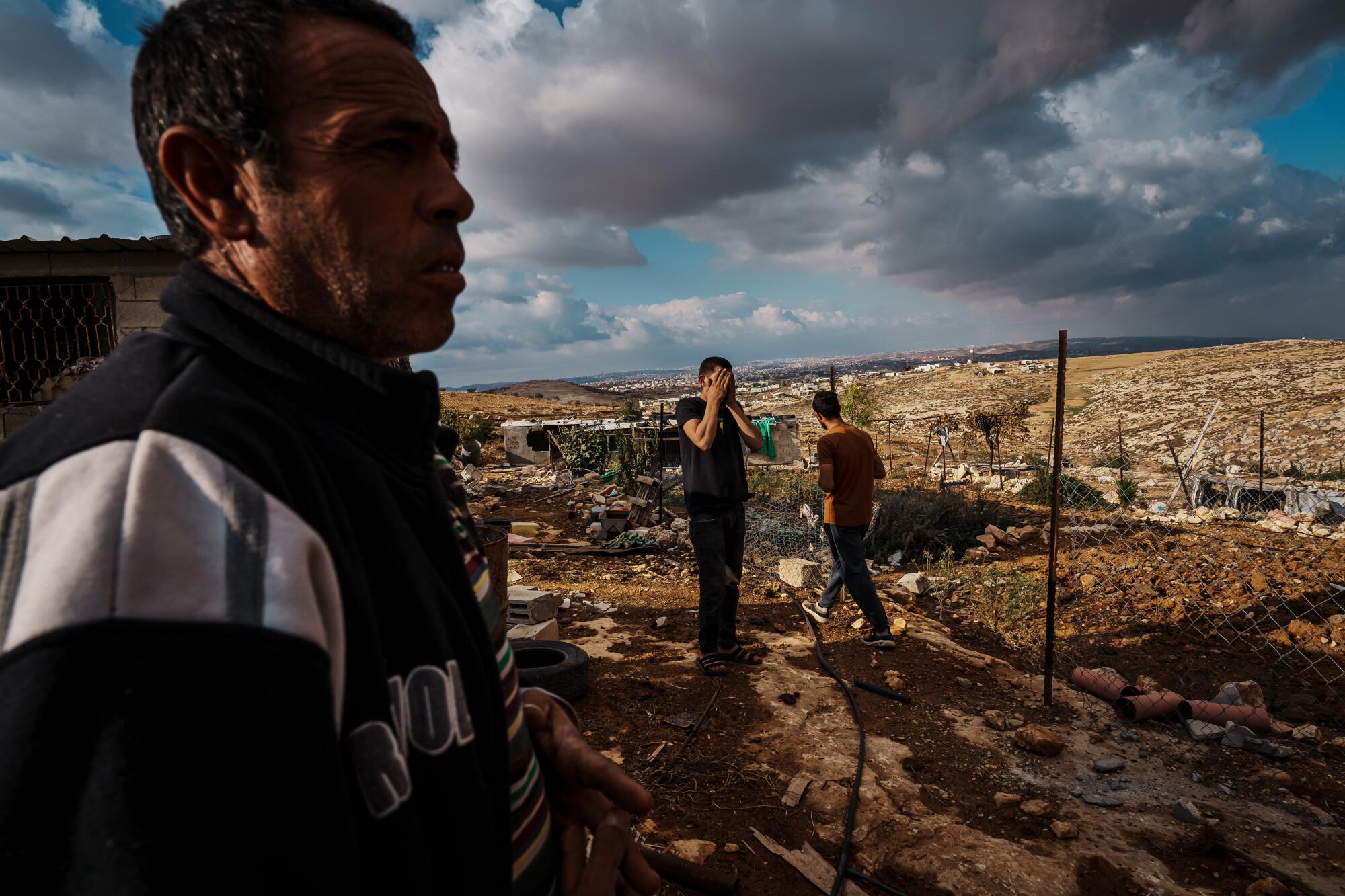 Mohammad Abed inspects the damage to his home and farmland, by Israeli settlers.