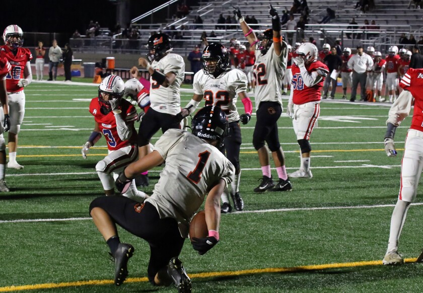 Los Amigos' Bao Huynh scores in the fourth quarter against Bolsa Grande in a Garden Grove League football game.