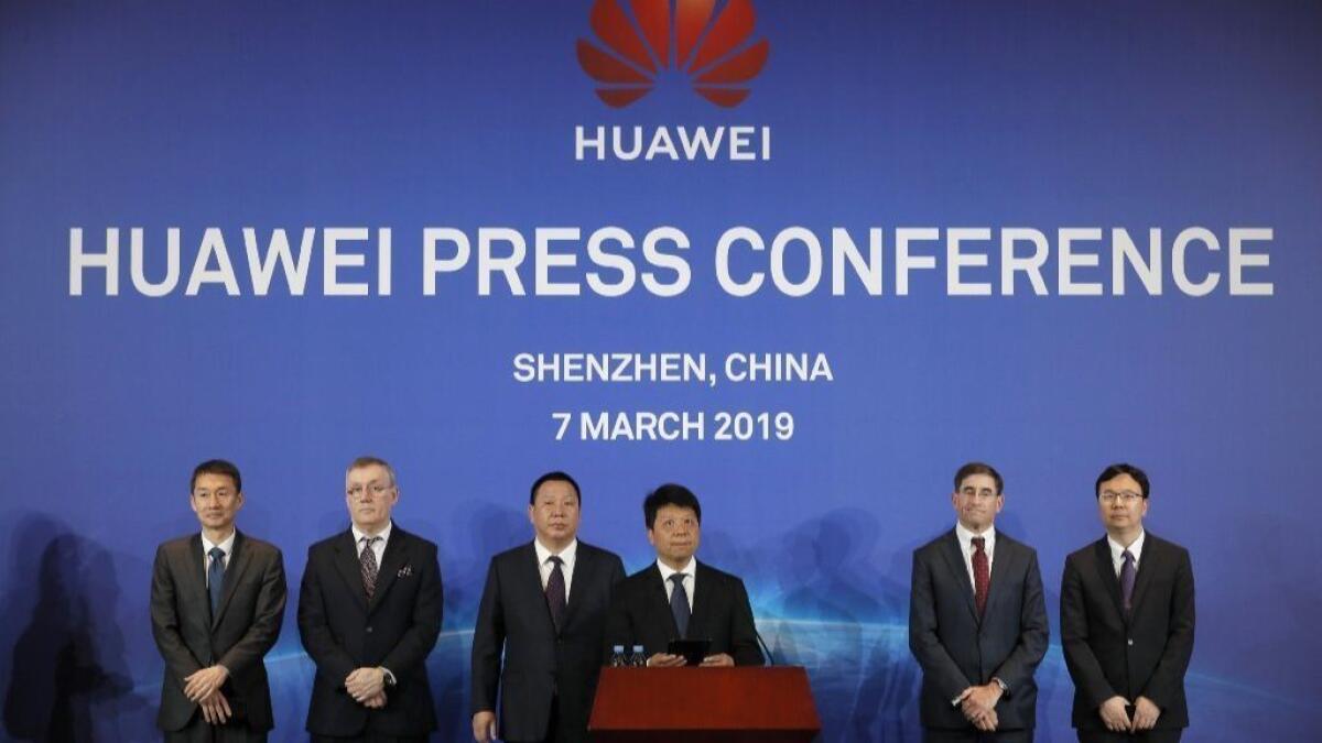 Trump bans Huawei in U.S. markets, saying Chinese firm poses