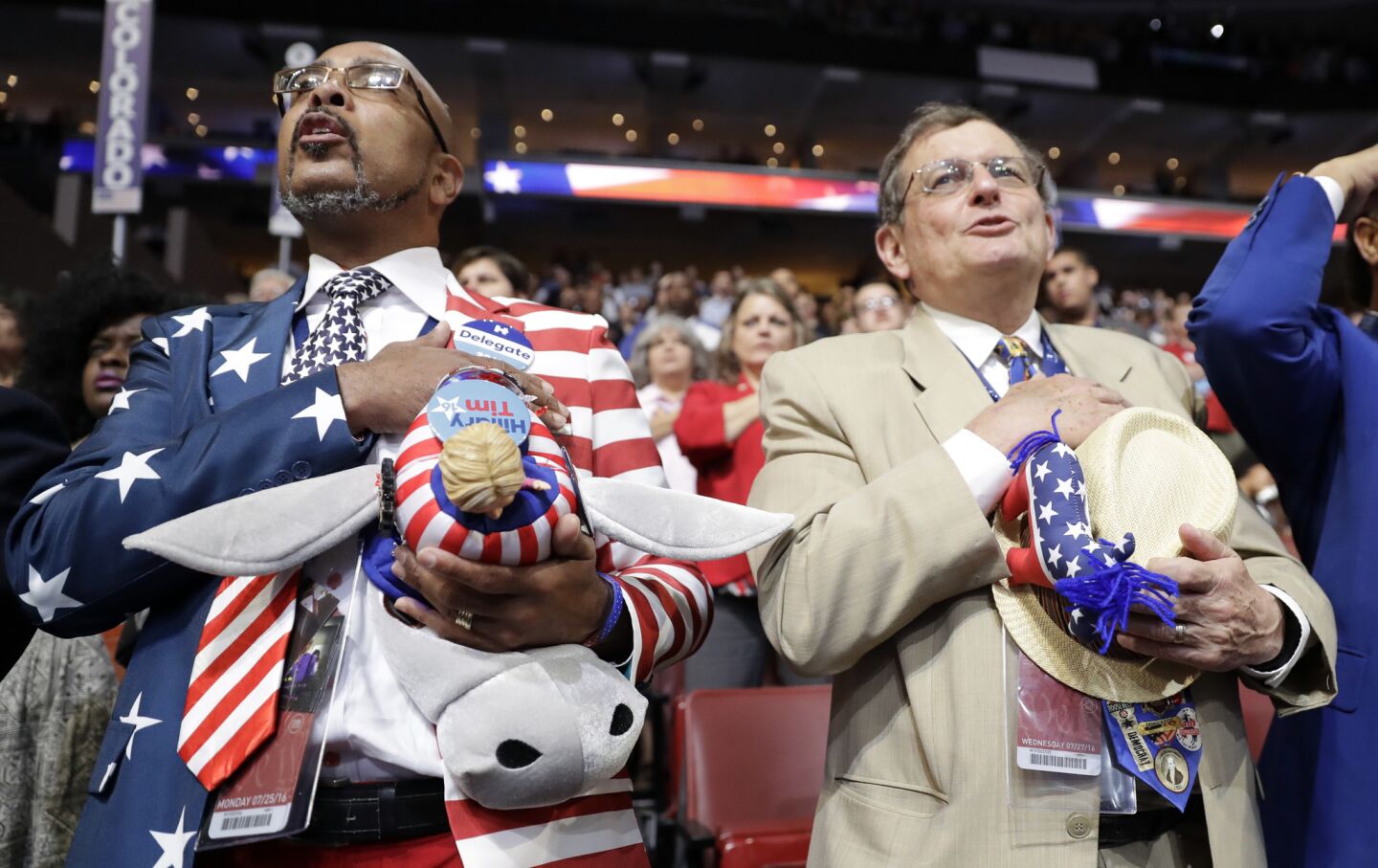 Louisiana delegates Rodney Mcfarland and Jim Harlan sing the national anthem during the third day session of the 2016 Democratic National Convention in Philadelphia on Wednesday.