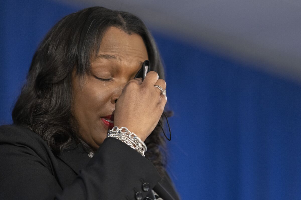Chicago Public Schools CEO Janice Jackson wipes away tears as she speaks about her time at CPS during a news conference, Monday, May 3, 2021 in Chicago. The leader of Chicago Public Schools announced that she is leaving the post later this year because it's time to “pass the torch to new leadership" of the nation's third-largest school district. (Anthony Vazquez/Chicago Sun-Times via AP)