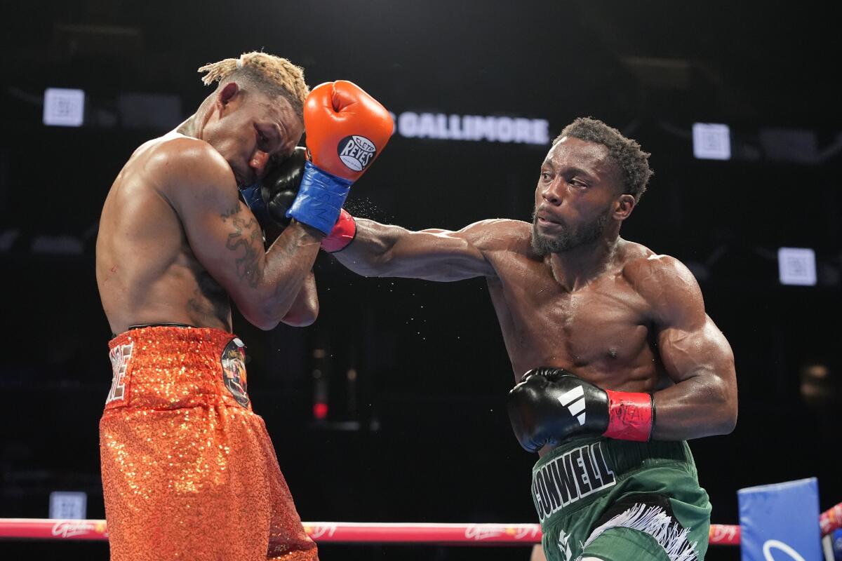 Charles Conwell, right, punches Nathaniel Gallimore during the fourth round of a super welterweight fight.