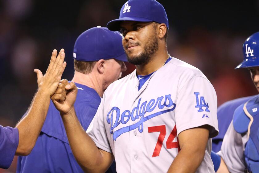 Dodgers closer Kenley Jansen celebrates with teammates after finishing off a game on the mound against teh Angels earlier this month.