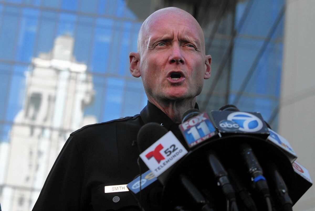 Cmdr. Andrew Smith, shown at a 2013 news conference, said the LAPD is withholding some details in the investigation of an officer-involved shooting until it can be verified.