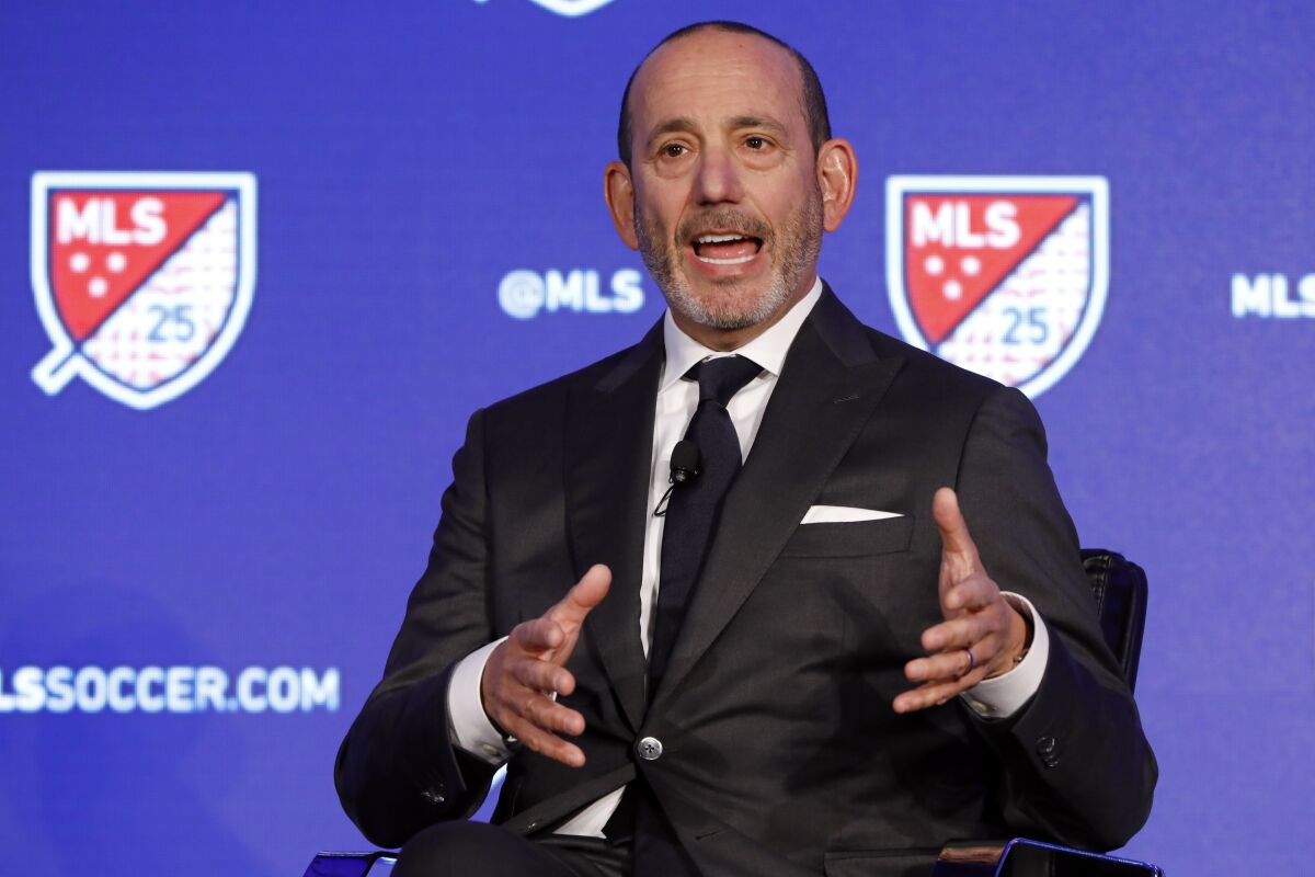 FILE - In this Feb. 26, 2020, file photo, Major League Soccer Commissioner Don Garber speaks during the Major League Soccer 25th Season kickoff event in New York. Major League Soccer said Saturday, Aug. 8, 2020, it will resume its season once the MLS is Back tournament in Florida wraps up. The league's 26 teams will each play 18 games, with the first between FC Dallas and Nashville set for Aug. 12.(AP Photo/Richard Drew, File)