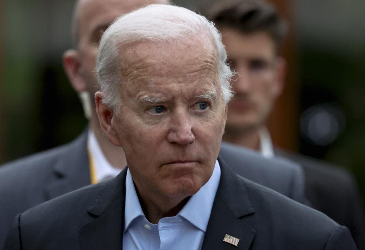 A close-up of President Biden, wearing an American flag pin on his lapel