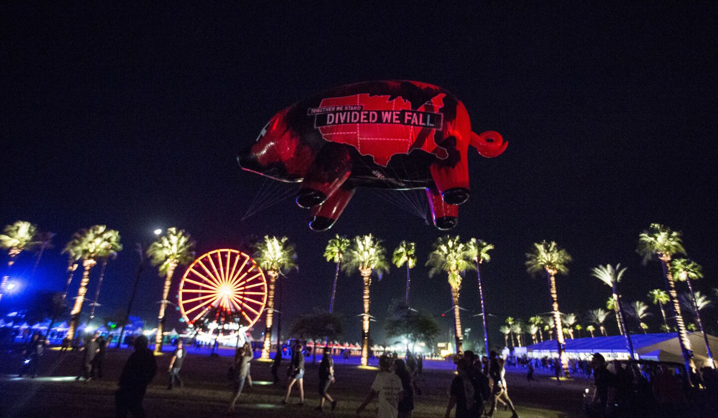 Flying over the venue during Roger Waters' set at Desert Trip is an inflated pig with 'Divided We Fall' written on the side of it.