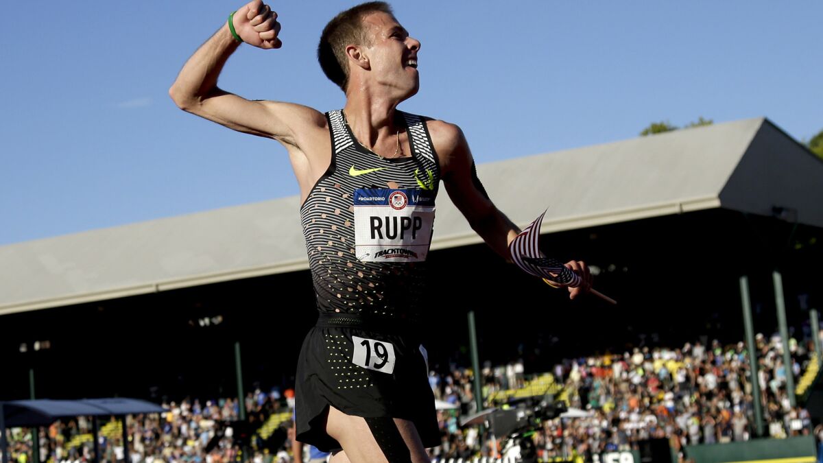 Galen Rupp celebrates after winning the 10,000-meter run at the U.S. Olympic track trials on Friday.