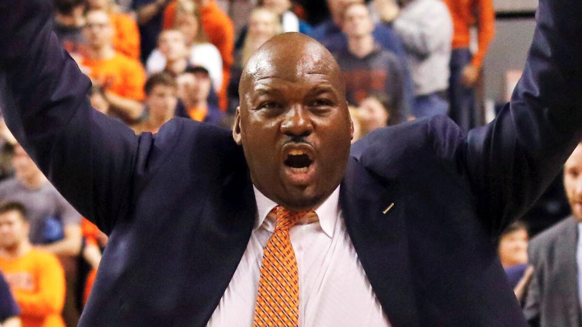Auburn assistant coach Chuck Person celebrates after a victory over Alabama on Jan. 19, 2016.