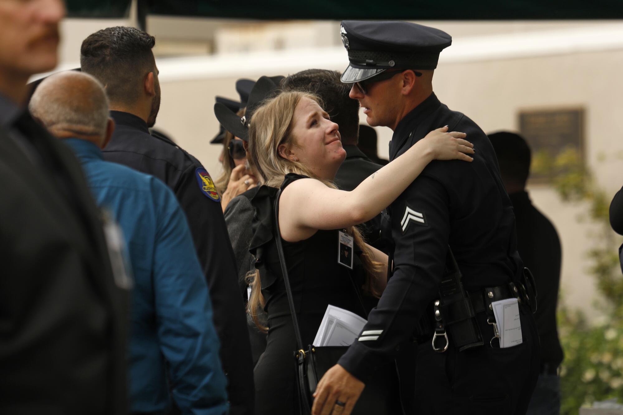 Family and friends mourn the loss of Officer Tipping