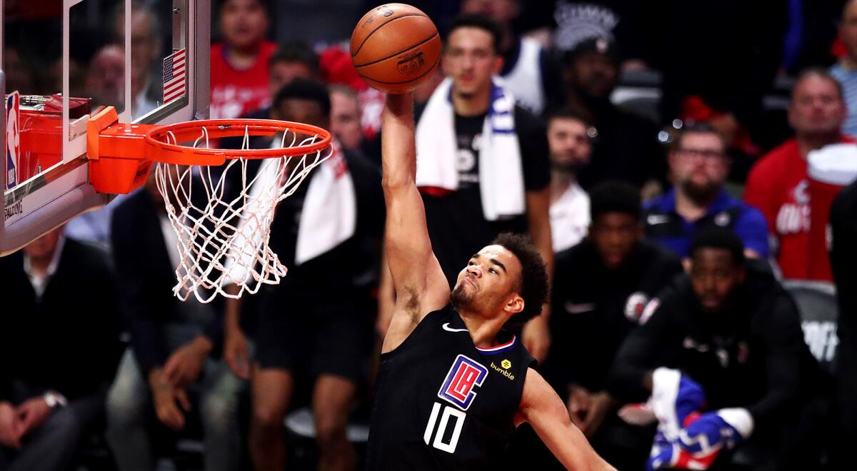 Clippers guard Jerome Robinson elevates for a dunk against the Warriors during the second quarter of Game 4.