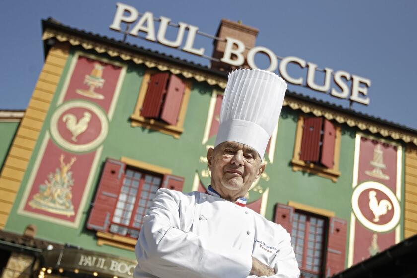 FILE - In this March 24, 2011 file French Chef Paul Bocuse poses outside his famed Michelin three-star restaurant L'Auberge du Pont de Collonges in Collonges-au-Mont-d'or, central France. French interior minister announces Saturday Jan.20, 2018 that Paul Bocuse, a master of French cuisine, has died at 91. (AP Photo/Laurent Cipriani, File)