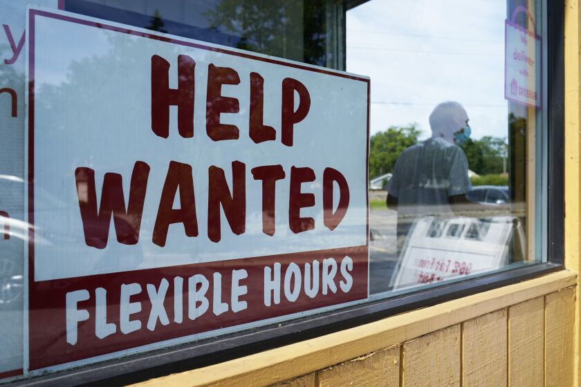 FILE - A Help wanted sign is displayed in Deerfield, Ill., Wednesday, Sept. 21, 2022. The Labor Department reports on Thursday the number of people who applied for unemployment benefits last week. (AP Photo/Nam Y. Huh, File)