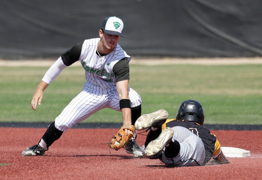 Thousand Oaks second baseman Roc Riggio tags out Newbury Park's Wesley De La Torre.