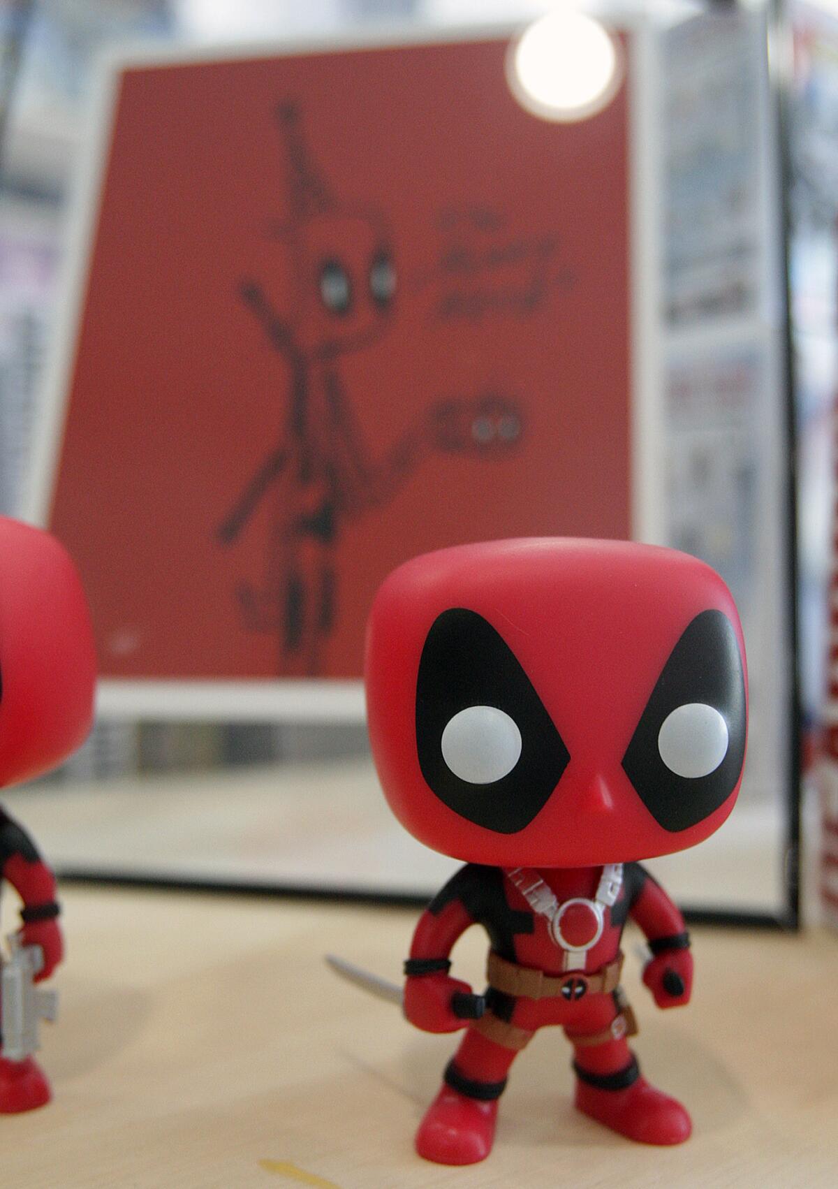 A Deadpool figure at The Perky Nerd, a 5-day old comic book and coffee store in Burbank on Thursday, April 28, 2016.