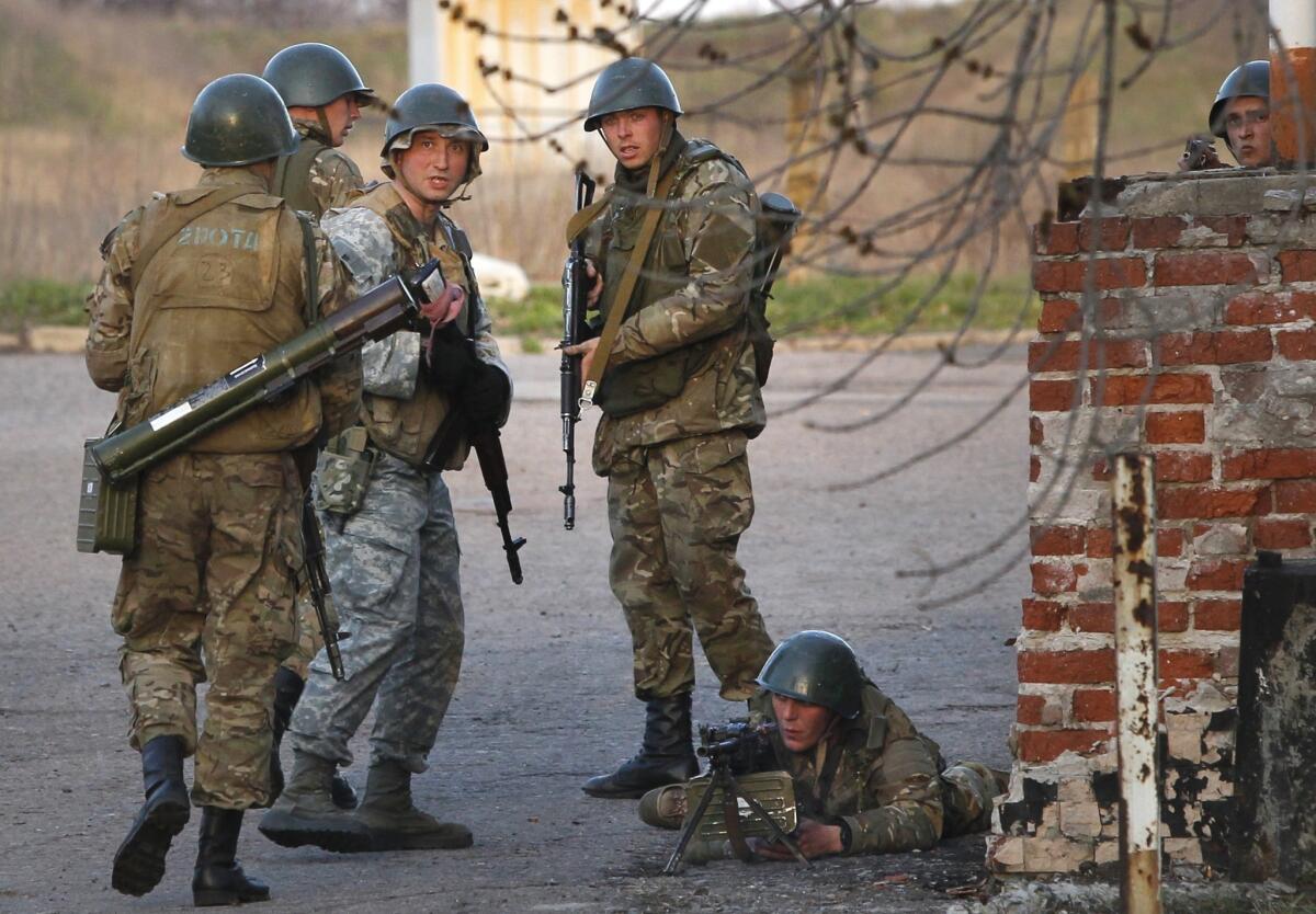 Ukrainian army troops set up a position at a Russian-occupied airport near the eastern city of Kramatorsk. The Ukrainian government later said it had "liberated" the airport, the first objective of its announced "anti-terrorist operation" to recover facilities seized by Russian gunmen in at least 10 towns and cities in eastern Ukraine.