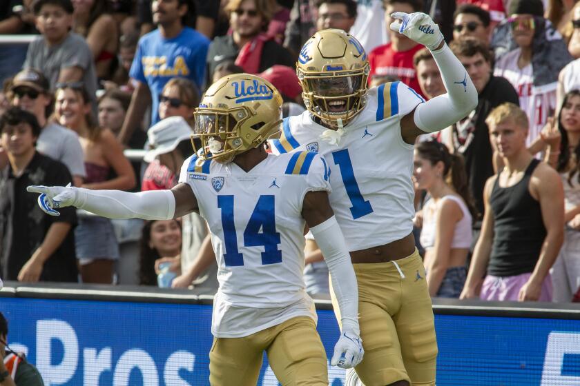 SAN DIEGO, CA - SEPTEMBER 09: UCLA wide receiver Josiah Norwood (14) celebrates his touchdown.