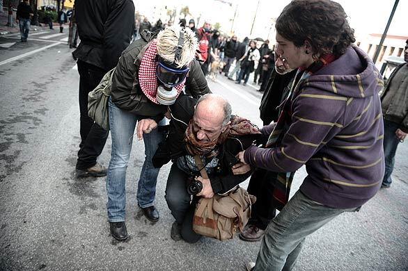 Rioting in Greece - photographer injured