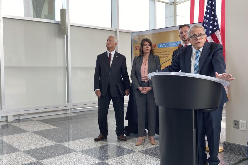 Ohio Gov. Mike DeWine discusses a law that gives school districts the option of arming trained school employees, on Monday, June 13, 2022, in Columbus, Ohio. The Republican DeWine signed the bill into law Monday and ordered the Ohio School Safety Center to require a maximum of 24 hours of initial training and eight hours of annual training. (AP Photo/Andrew Welsh-Huggins)